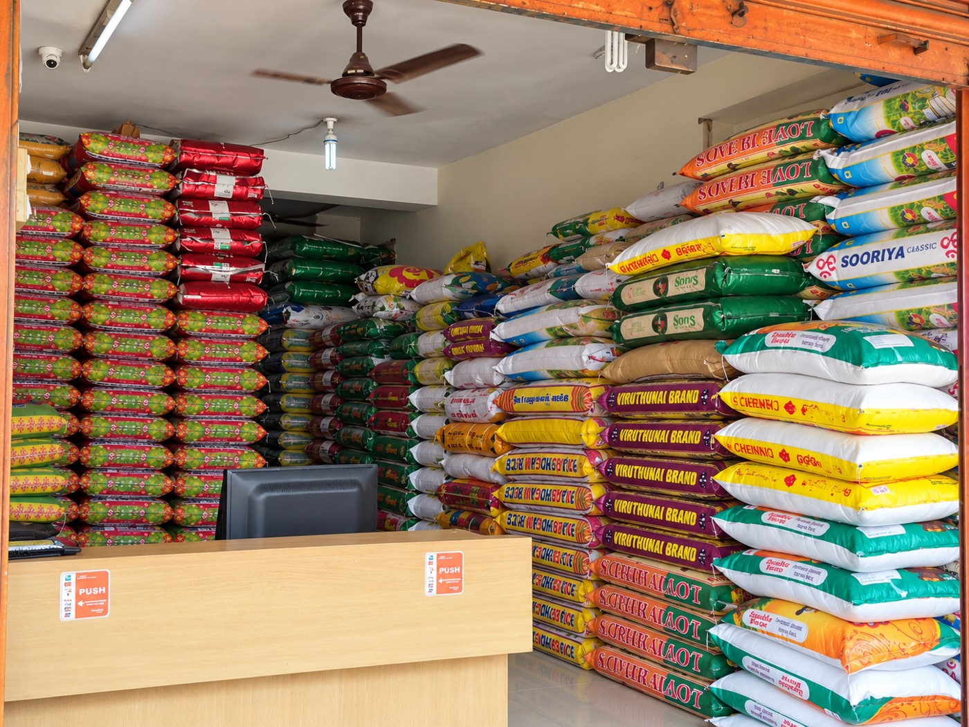 Enhanced view of neatly stacked rice bags at RM Vasanth Stores